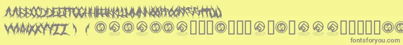 フォントGrindmafia – 黄色の背景に灰色の文字