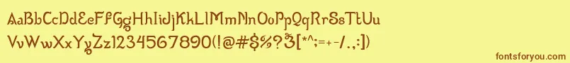 フォントWizzta – 茶色の文字が黄色の背景にあります。