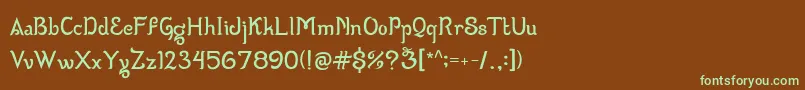 フォントWizzta – 緑色の文字が茶色の背景にあります。