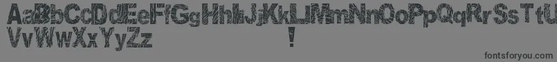 フォントDistortedAndScratchy – 黒い文字の灰色の背景