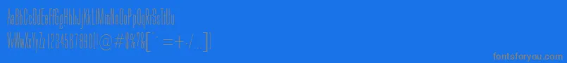 GoldhawkRegularDb-fontti – harmaat kirjasimet sinisellä taustalla