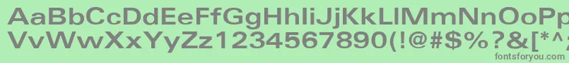 UniversBoldext-fontti – harmaat kirjasimet vihreällä taustalla
