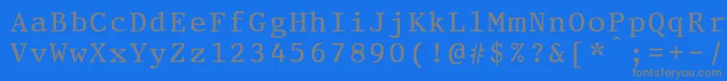 PrestigeeliteboldBold-Schriftart – Graue Schriften auf blauem Hintergrund