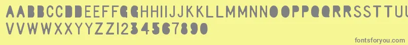 RulerElementary Font – Gray Fonts on Yellow Background