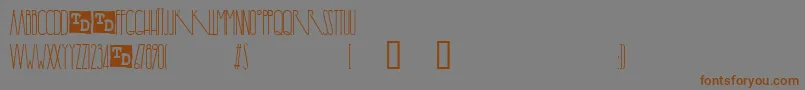 フォントYaroslavTrialVersion – 茶色の文字が灰色の背景にあります。
