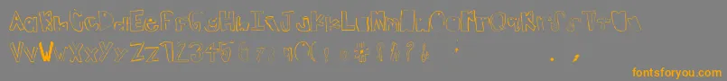フォントTeenageDream – オレンジの文字は灰色の背景にあります。