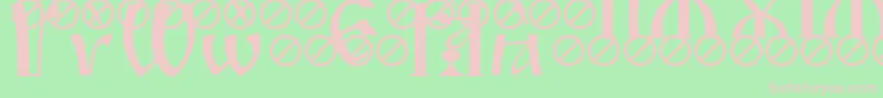 フォントIrmologionGrave – 緑の背景にピンクのフォント