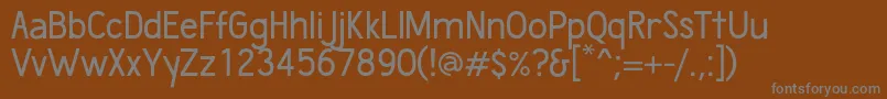 フォントWumbology – 茶色の背景に灰色の文字