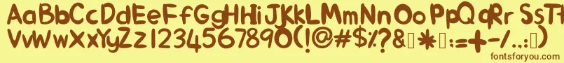 フォントAlinKid – 茶色の文字が黄色の背景にあります。