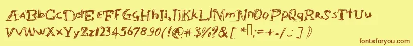 フォントAbracadabrahocusspokuz – 茶色の文字が黄色の背景にあります。