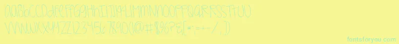 フォントKggirlonfire – 黄色い背景に緑の文字