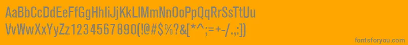 AnconaNarrowRegular-fontti – harmaat kirjasimet oranssilla taustalla