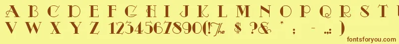 フォントOdalisqu – 茶色の文字が黄色の背景にあります。