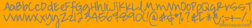 DjbSmartyPants-fontti – harmaat kirjasimet oranssilla taustalla