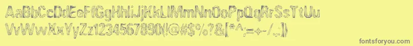 フォントAngia – 黄色の背景に灰色の文字