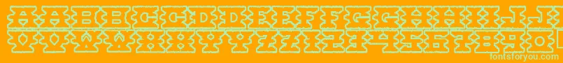 フォントMontezumaancient – オレンジの背景に緑のフォント