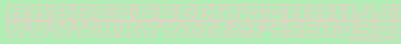 Montezumaancient-fontti – vaaleanpunaiset fontit vihreällä taustalla