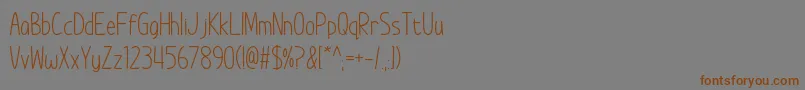 ImWunderland Font – Brown Fonts on Gray Background