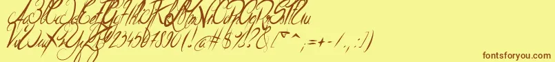 フォントElegantDragonItalic – 茶色の文字が黄色の背景にあります。