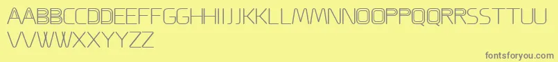 ACappella-fontti – harmaat kirjasimet keltaisella taustalla