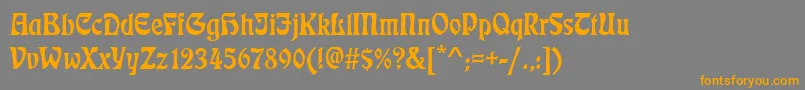 フォントEckmannd – オレンジの文字は灰色の背景にあります。