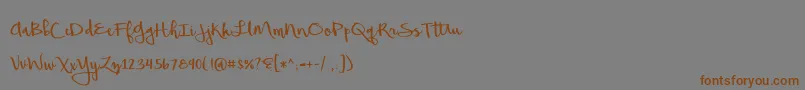 フォントBeautifulMess – 茶色の文字が灰色の背景にあります。