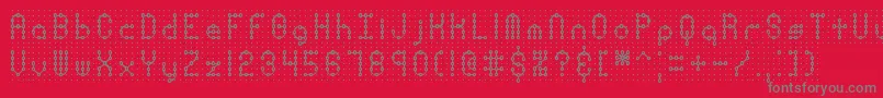 Czcionka PindownPlainBrk – szare czcionki na czerwonym tle