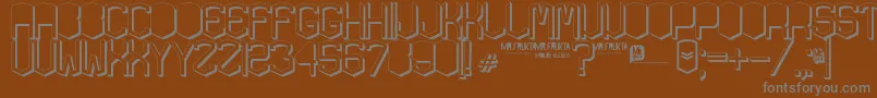 KardonGros-Schriftart – Graue Schriften auf braunem Hintergrund