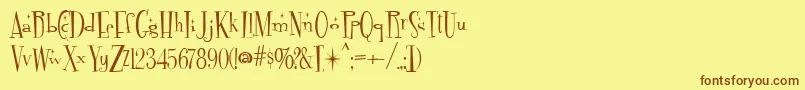 Fontdinerdotcom Sparkly Font – Brown Fonts on Yellow Background