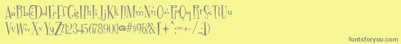 Fontdinerdotcom Sparkly Font – Gray Fonts on Yellow Background