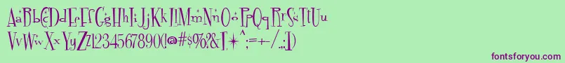 フォントFontdinerdotcom Sparkly – 緑の背景に紫のフォント
