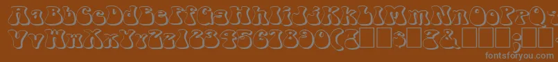 Fonte FzJazzy143DEx – fontes cinzas em um fundo marrom