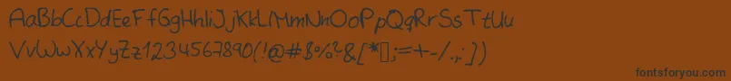 フォントSameMistakeKopie – 黒い文字が茶色の背景にあります