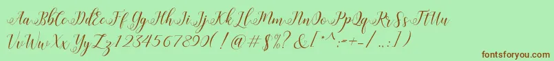 HisteriaScriptDemo-Schriftart – Braune Schriften auf grünem Hintergrund