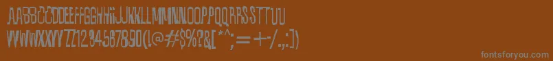 フォントQuixotic – 茶色の背景に灰色の文字