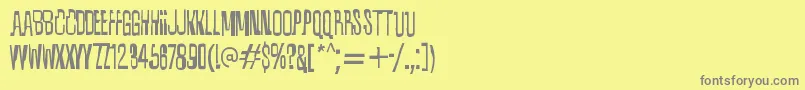 フォントQuixotic – 黄色の背景に灰色の文字