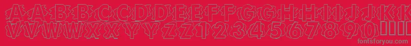 Fonte LmsScrapPaper – fontes cinzas em um fundo vermelho