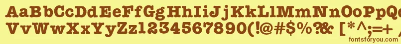 TypewritercBold-Schriftart – Braune Schriften auf gelbem Hintergrund
