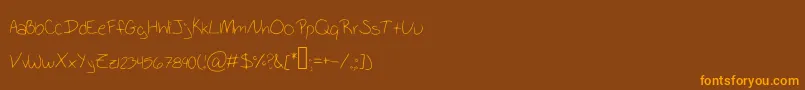 SchoolWriting Font – Orange Fonts on Brown Background