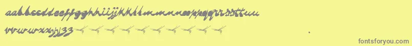 Fonte Dragonflysaji – fontes cinzas em um fundo amarelo