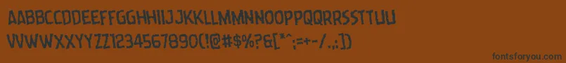 Wormcuisinerotate Font – Black Fonts on Brown Background