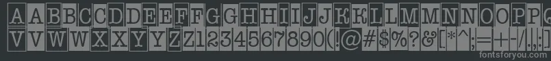 AOldtypernrcmcmb1-fontti – harmaat kirjasimet mustalla taustalla