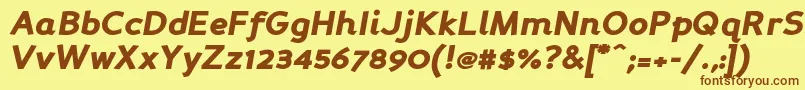 フォントPersabki – 茶色の文字が黄色の背景にあります。