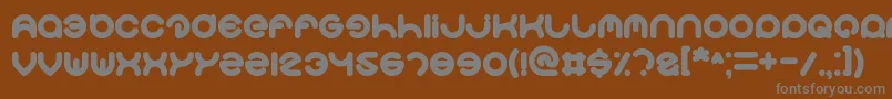 Smiley-fontti – harmaat kirjasimet ruskealla taustalla