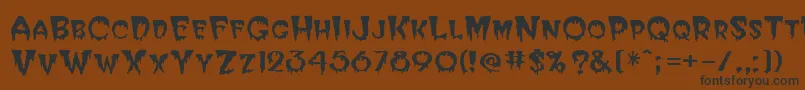 Hallween-Schriftart – Schwarze Schriften auf braunem Hintergrund