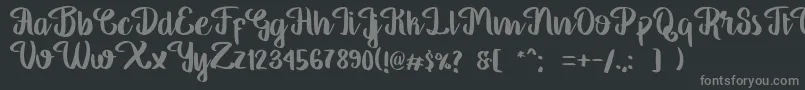 GeorgiaScript-fontti – harmaat kirjasimet mustalla taustalla