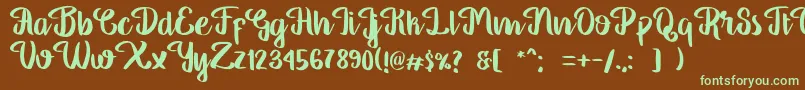 フォントGeorgiaScript – 緑色の文字が茶色の背景にあります。