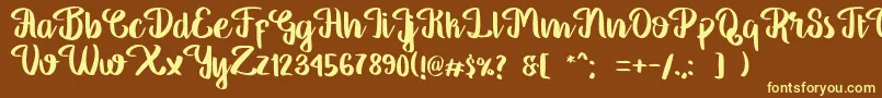 GeorgiaScript-fontti – keltaiset fontit ruskealla taustalla