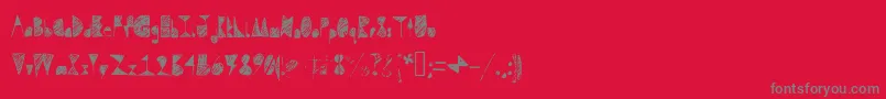 Fonte Questradoodle – fontes cinzas em um fundo vermelho