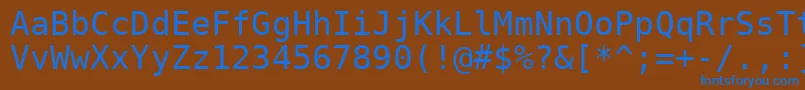 Dejavusansmono-fontti – siniset fontit ruskealla taustalla